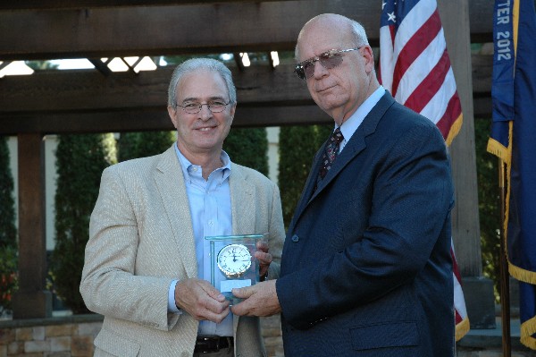 At the chapter�s August social, Schneider (r) presents Dave LaRochelle, former chapter president and board chairman, with the AFCEA International Award for Leadership.